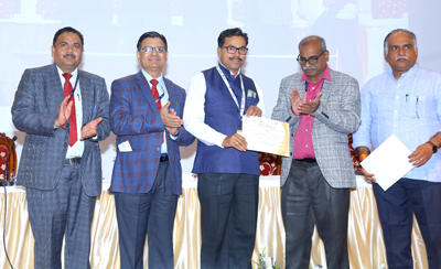 Dr B V Asewar receiving Best Oral Presentation Award